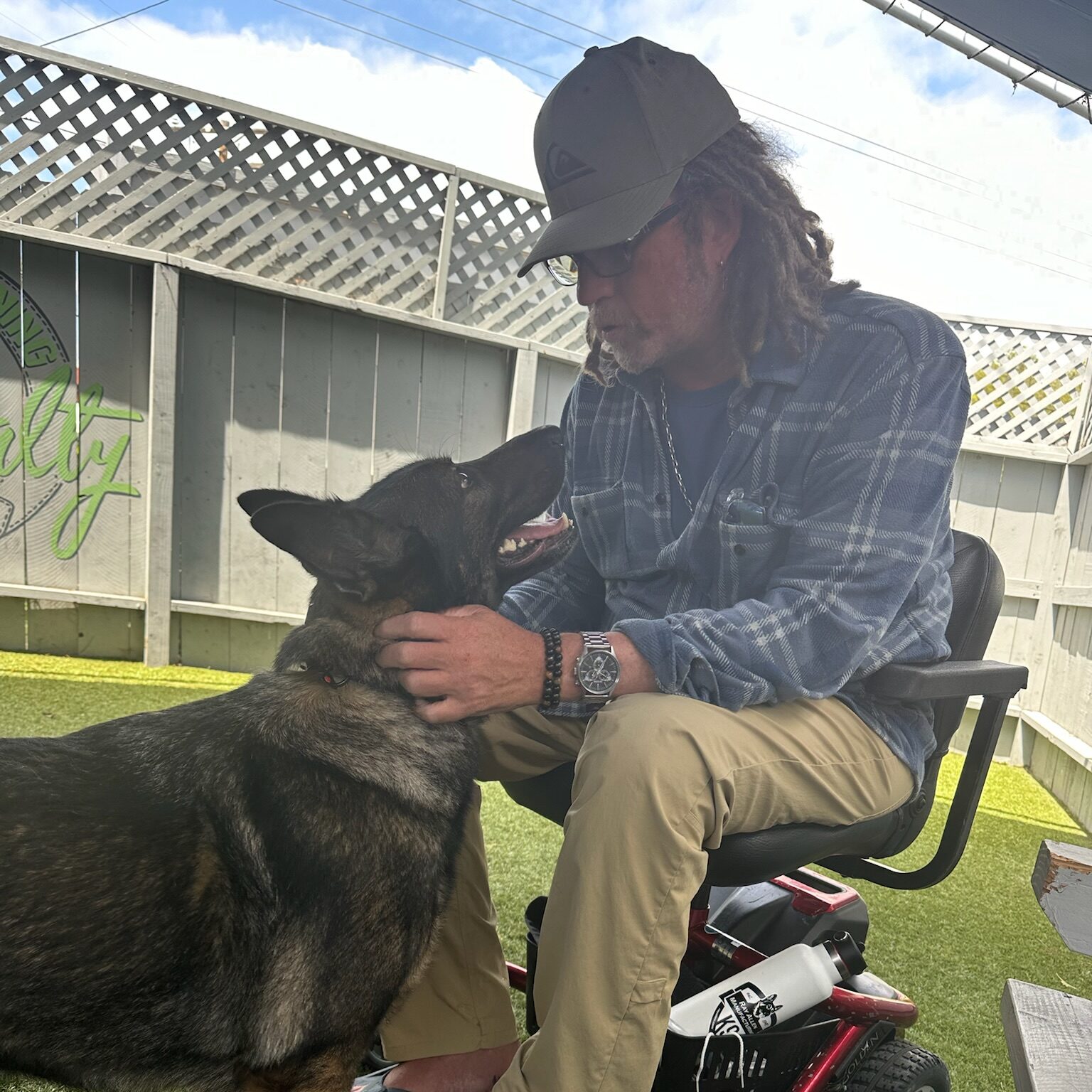 Man in wheelchair meets his service dog for the first time.